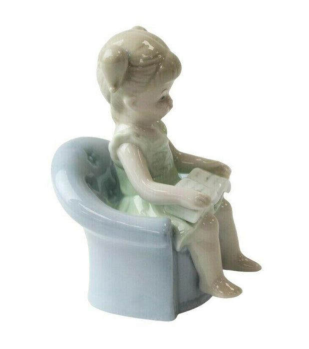 Little Girl Figurine - Young Child On Couch Small Porcelain Shelf Ornament 11cm