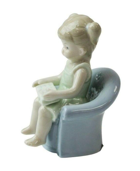 Little Girl Figurine - Young Child On Couch Small Porcelain Shelf Ornament 11cm